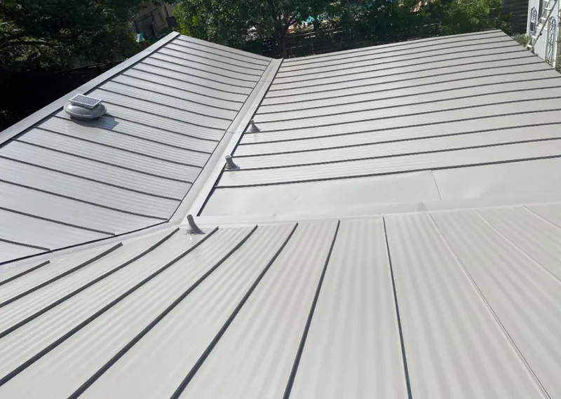 Solar attic fan installed on a metal roof for Roof Ventilation in Strasburg